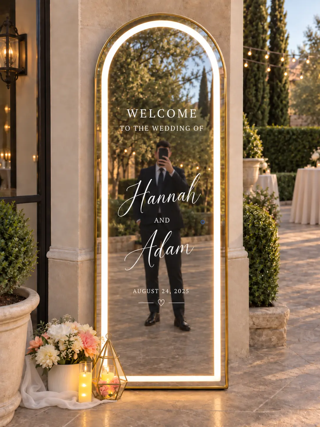 A guest taking a mirror selfie in the LED arch welcome mirror at a venue entrance